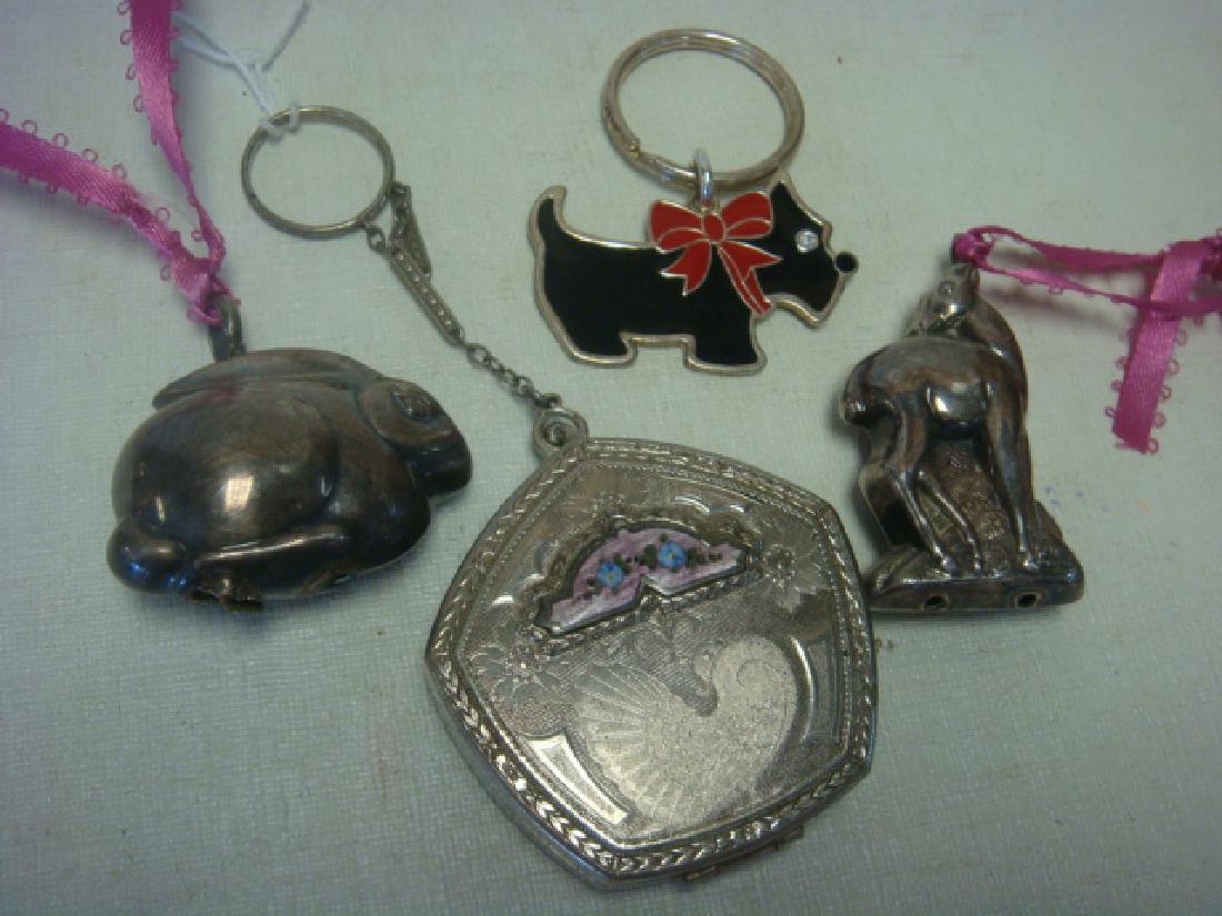 Silver Metal Change Purse and 3 Key Chain/Charms:: Silver Metal Change Purse and 3 Key Chain/Charms: Nouveau Pentagon Shaped with Ring and Chain, Etched Design with Florals and Peacock. Scottie, Deer and Rabbit Keychains. (60-120)