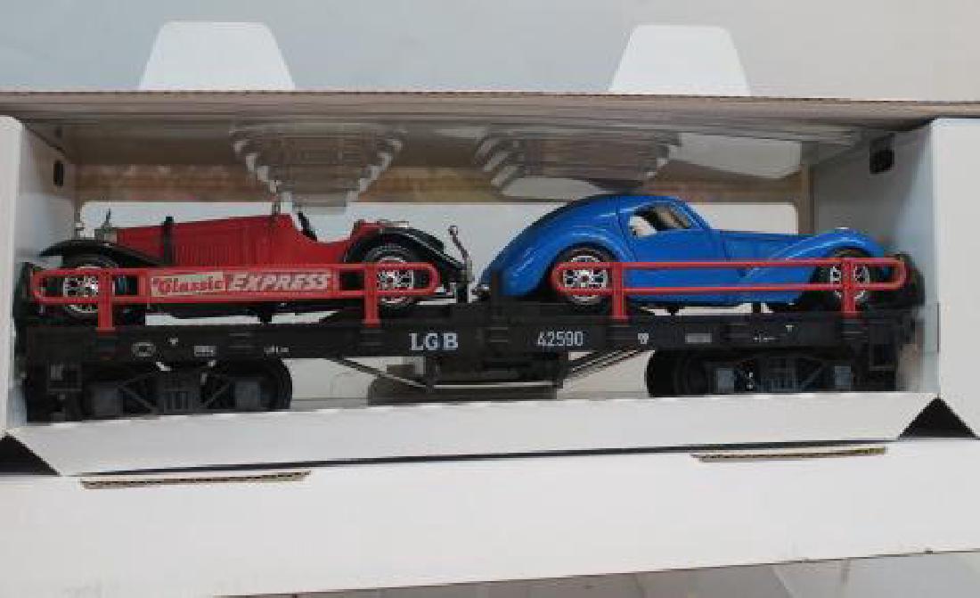 LGB 42590 CLASSIC EXPRESS AUTO TRANSPORT CAR:: LGB 42590 CLASSIC EXPRESS AUTO TRANSPORT CAR: G-Scale Model with Two Burago Die Cast Cars, Blue Burgati Coupe and Red MG Sports Car on Flat car. C-8 Like New Condition in Box, Shipping Weight 5 lbs. (