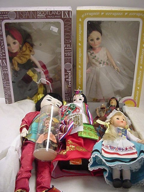 2 Collector Dolls, International Dolls, Doll Cover: 2 Collector Dolls, International Dolls, Doll Covers: Effanbee 11" Pavlova and Brazil Dolls are in Original Boxes. 3 1/2"T. German Doll in Plastic Tube includes German Coins. 7" Vinyl Dutch Doll, 13" C