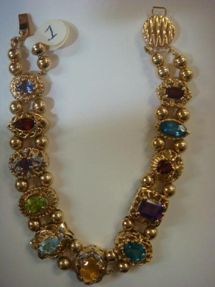 14 KT Slide Bracelet with 11 Gemstone Slides:: 14 KT Slide Bracelet with 11 Gemstone Slides: Marked 585. Each Slide with Different Cut Gemstone in Fancy Designed Frames with Open Back. Positioned on Slide Along Double Chain Separated by Gold Beads