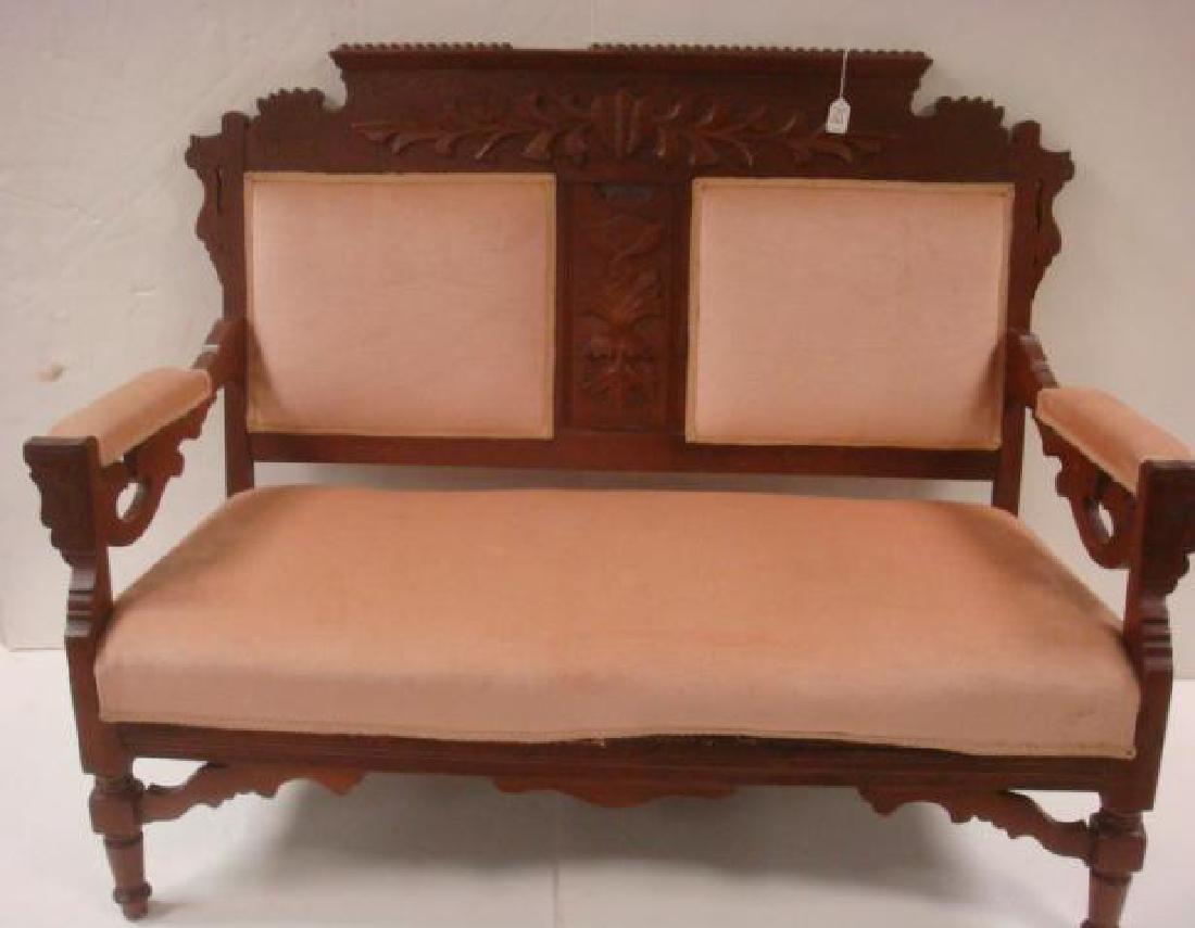 19th C. Walnut Framed Settee:: 19th C. Walnut Framed Settee: Eastlake Period Settee with Beaded Crest Rail having Foliate and Floral Incised and Applied Carving. Shaped Braces under Arms and Legs. Settee Upholstered with Pink Velve