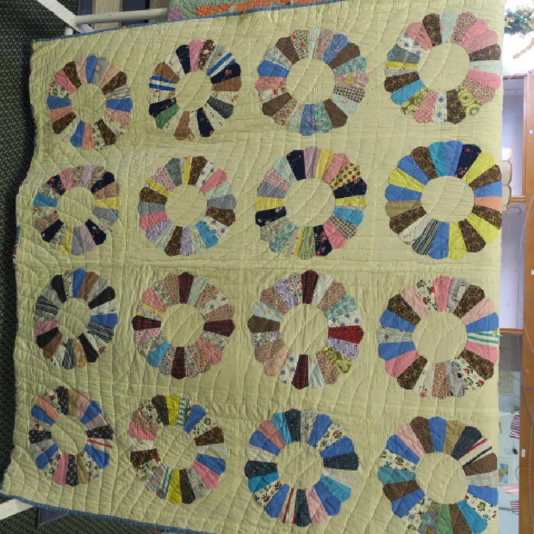 Handstitched Quilt Detailed Printed Pinwheel Pattern:: Handstitched Quilt Detailed Printed Pinwheel Pattern: 64" x 80" Multi Colored Pinwheels on Front, Cream Ground on Reverse with Appliqued Dresden Plate Pattern. No Rips, Tears, or Staining. (150-300)