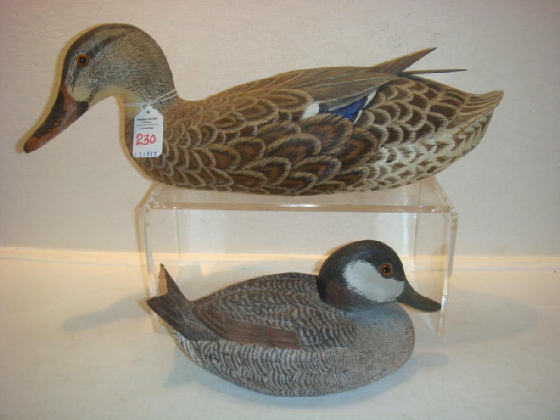 Two Signed Hen Carved Duck Decoys JONES & DASHULL:: Two Signed Hen Carved Duck Decoys JONES & DASHULL: Signed Douglas E Jones Carved Decoy, Damage to Tail Feathers. Signed J.C. Dashell Carved Decoy, Damage to Tail Feathers. (150-300)
