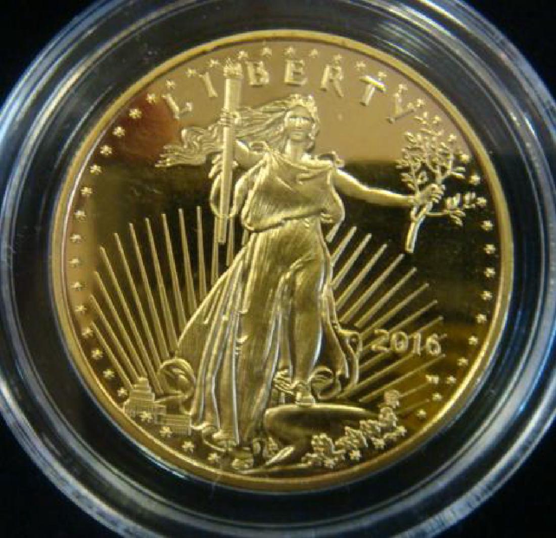 2016 AMERICAN EAGLE ONE OUNCE GOLD UNCIRCULATED COIN:: 2016 AMERICAN EAGLE ONE OUNCE GOLD UNCIRCULATED COIN: $50, One Troy Ounce of Gold With Certificate of Authenticity in Clear Plastic Holder and Box. Obverse, Augustus Saint Gaudens Lady Liberty with To
