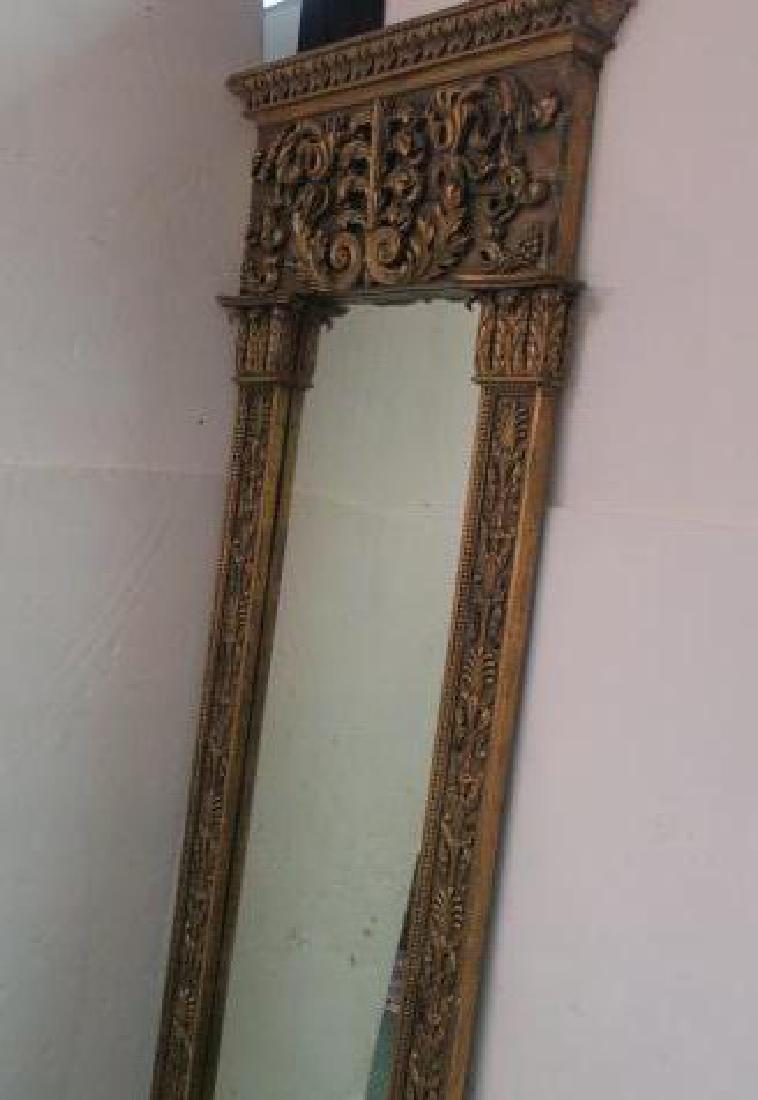 Carved Gilt Regency Leaner Floor Mirror:: Carved Gilt Regency Leaner Floor Mirror: Plate Mirror with a Grand Design to Resemble a Portal. The Shafts of the Intricately Carved Side Columns are Edged in Egg and Dart Pattern. Acanthus Leaf Capit