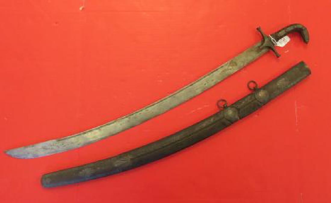 Antique Persian Scimitar with Leather Wood Scabbard:: Antique Persian Scimitar with Leather Wood Scabbard: Natural Engraving on Pommel and Wooden Handle adorned with Rivets & Studs. Hand forged 31" Heavy Curved Blade With Engraving an Deep Blood Grove. L