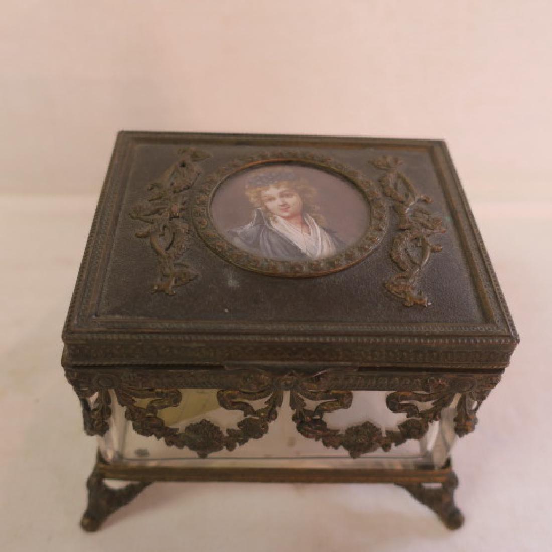 Dore Bronze Ormolu Jewelry Casket with Portrait:: Dore Bronze Ormolu Jewelry Casket with Portrait: Glass Victorian Vanity Box with Draped Swags around Top and Flanking the Center Portrait on Top. Padded Silk Inside Under Lid and Set on Fitted Stand w
