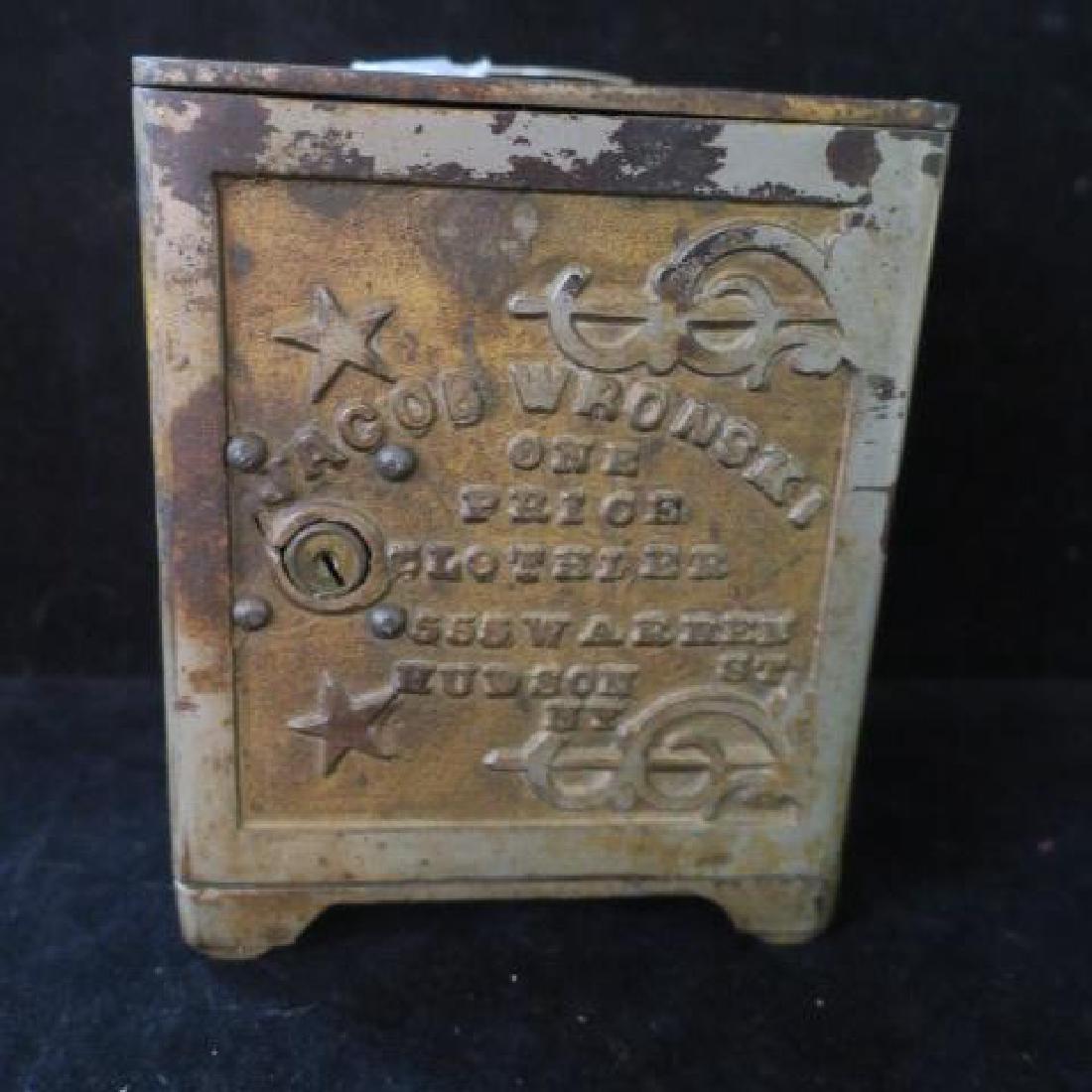 Antique Safe Style Cast Iron Bank "JACOB WRONSKI":: Antique Safe Style Cast Iron Bank "JACOB WRONSKI": Safe is Surrounded with Stars and Sponsored by "JACOB WRONSKI, ONE PRICE CLOTHIER 555 W ARREN ST, HUDSON NY". 6 1/8" Tall and 5" Square. No Key. (80-