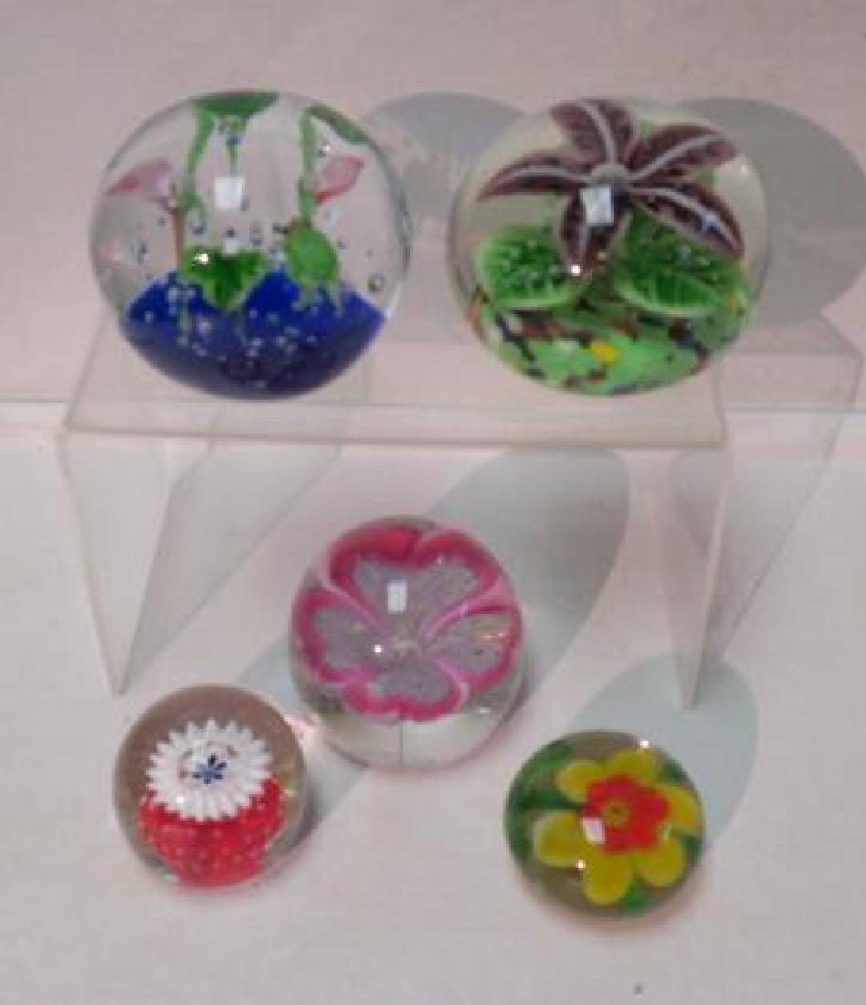 Five Flower Themed Art Glass Paperweights:: Five Flower Themed Art Glass Paperweights: 3 1/2" Cactus Flower, 3" Pink and Red Four Petaled Flower, 3 1/2" Water Lilies with Frog and Controlled Bubbles, 2" White Millifore Cactus Flower 2 1/4" Yell
