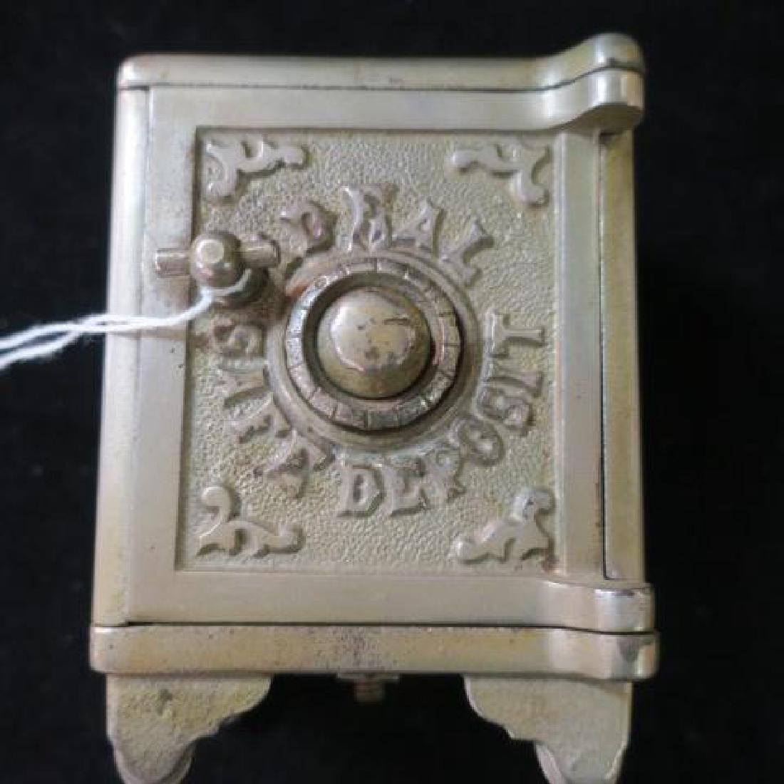 Antique Nickel Plated "IDEAL SAFE DEPOSIT" Bank:: Antique Nickel Plated "IDEAL SAFE DEPOSIT" Bank: 4 1/8" Tall, 3" Wide, 2 1/2" Deep. (80-150)