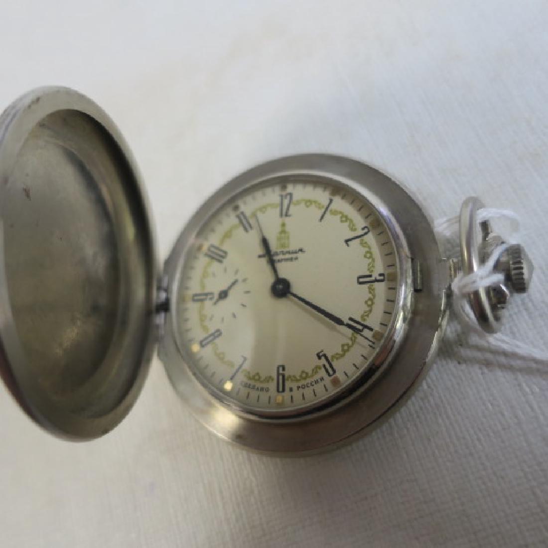MARHUR Russian Pocket Watch:: MARHUR Russian Pocket Watch: Silvertone Case with Raised Relief of Soldier on Horse on Front and Village Landscape on Back. 15 Kamhen (Jewel) Model. Circa 1970. Second Hand at "9", Push Button Crown R