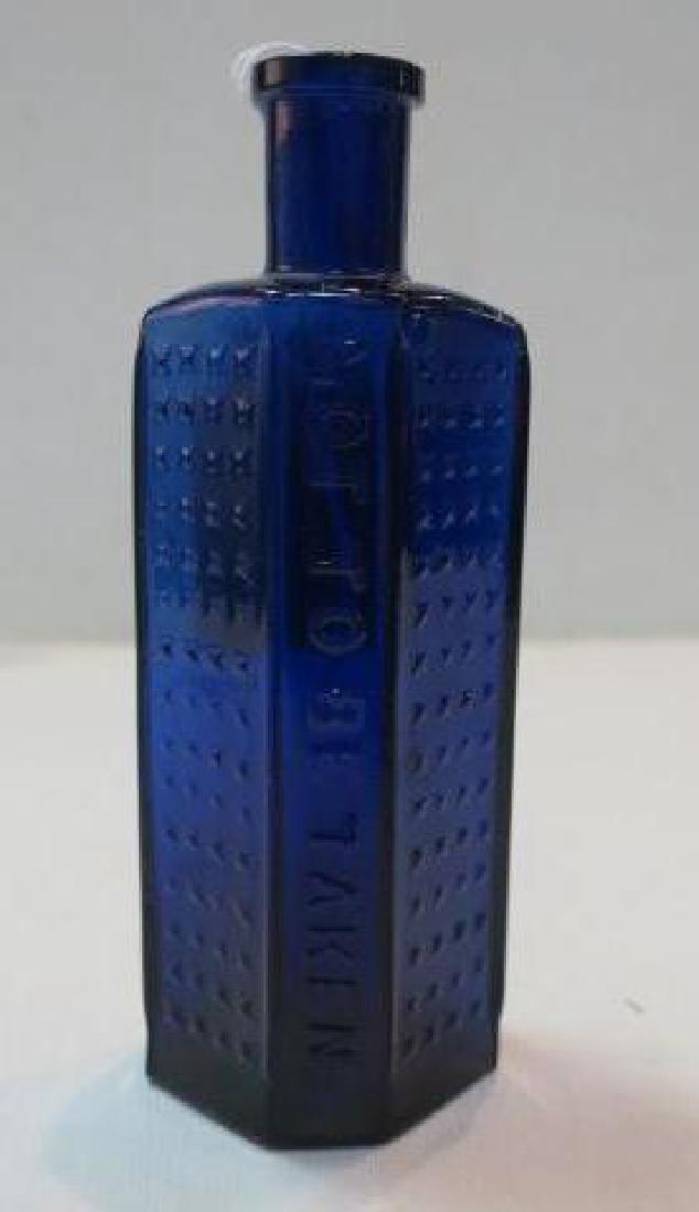 POISON BOTTLE, COBALT Bottle Embossed Stars 2 Sides: (1 of 5)