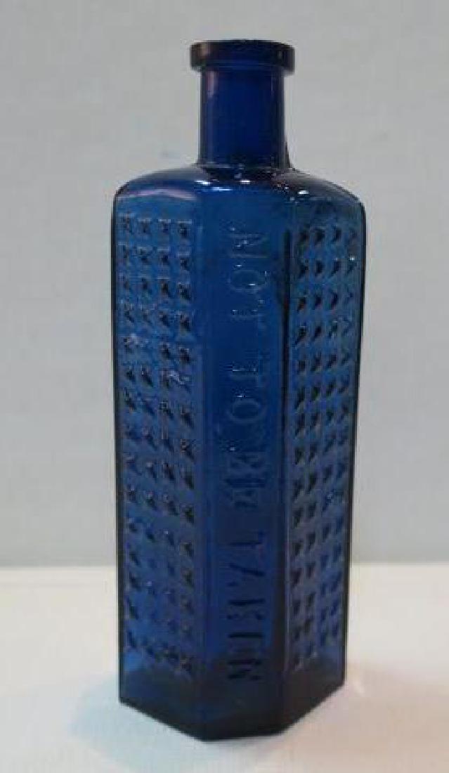 POISON BOTTLE, COBALT Bottle Embossed Stars 2 Sides: (1 of 3)