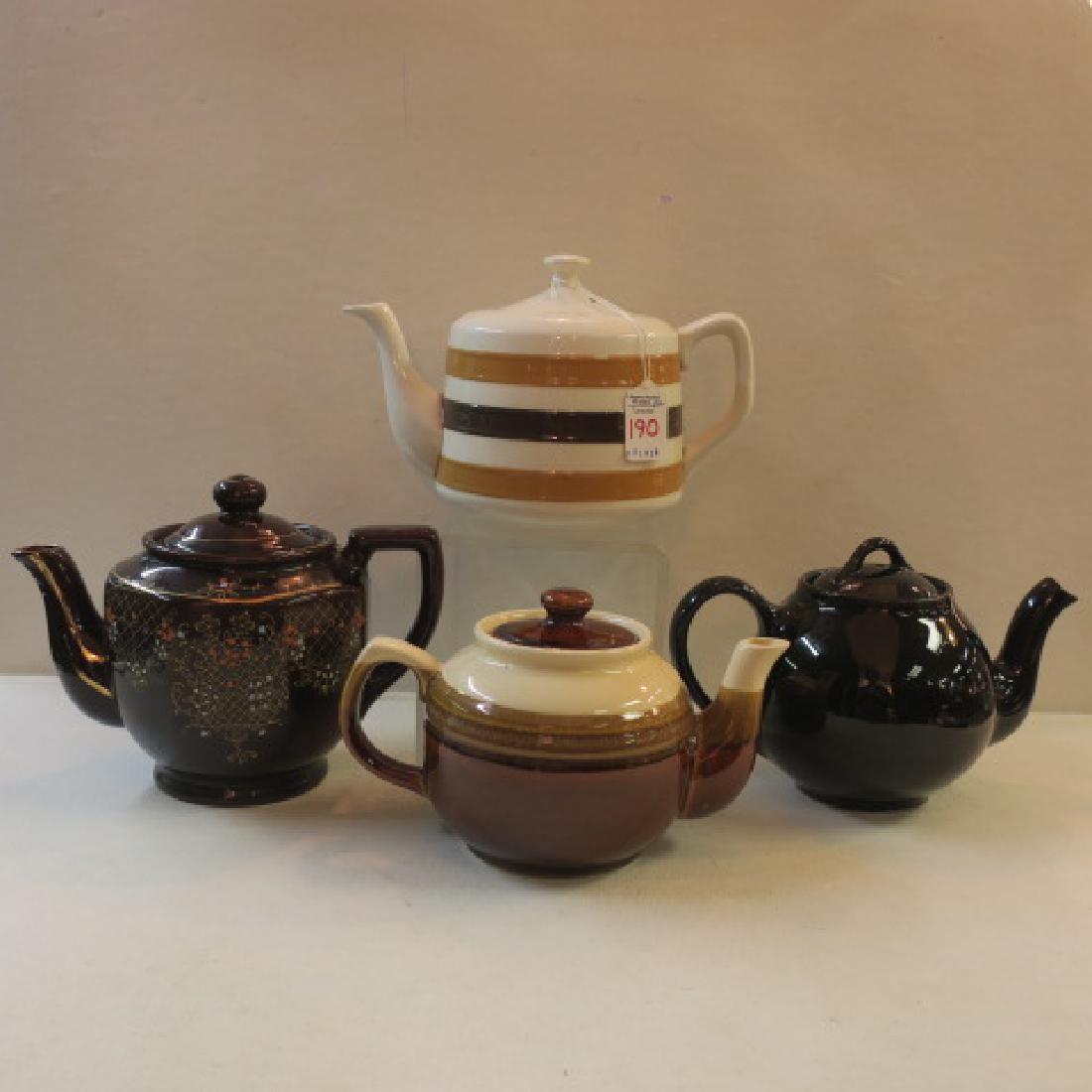 Four Vintage Ceramic Teapots:: Four Vintage Ceramic Teapots: Redware Teapot with Enamel Flowers and Striped Teapot Marked Japan. Black Ball Teapot with Molded Lipton's Tea on Bottom. Unmarked Striped Teapot. (100-200)