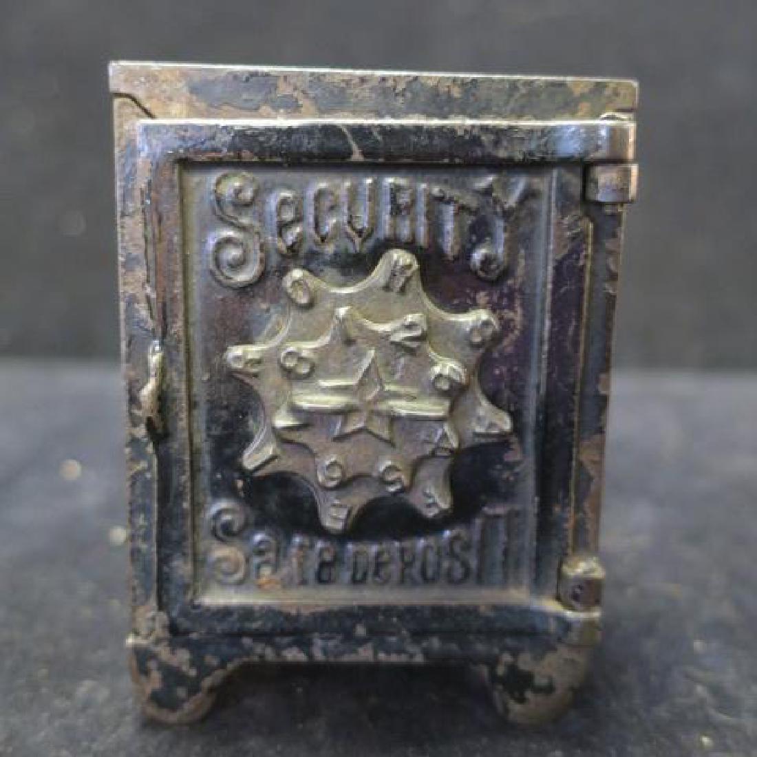Antique SECURITY SAFE DEPOSIT Cast Iron Bank:: Antique SECURITY SAFE DEPOSIT Cast Iron Bank: Combination Lock Bank Decorated with Stars and Palm Ferns. 4" X 2 3/4" X 2 3/8" (80-150)