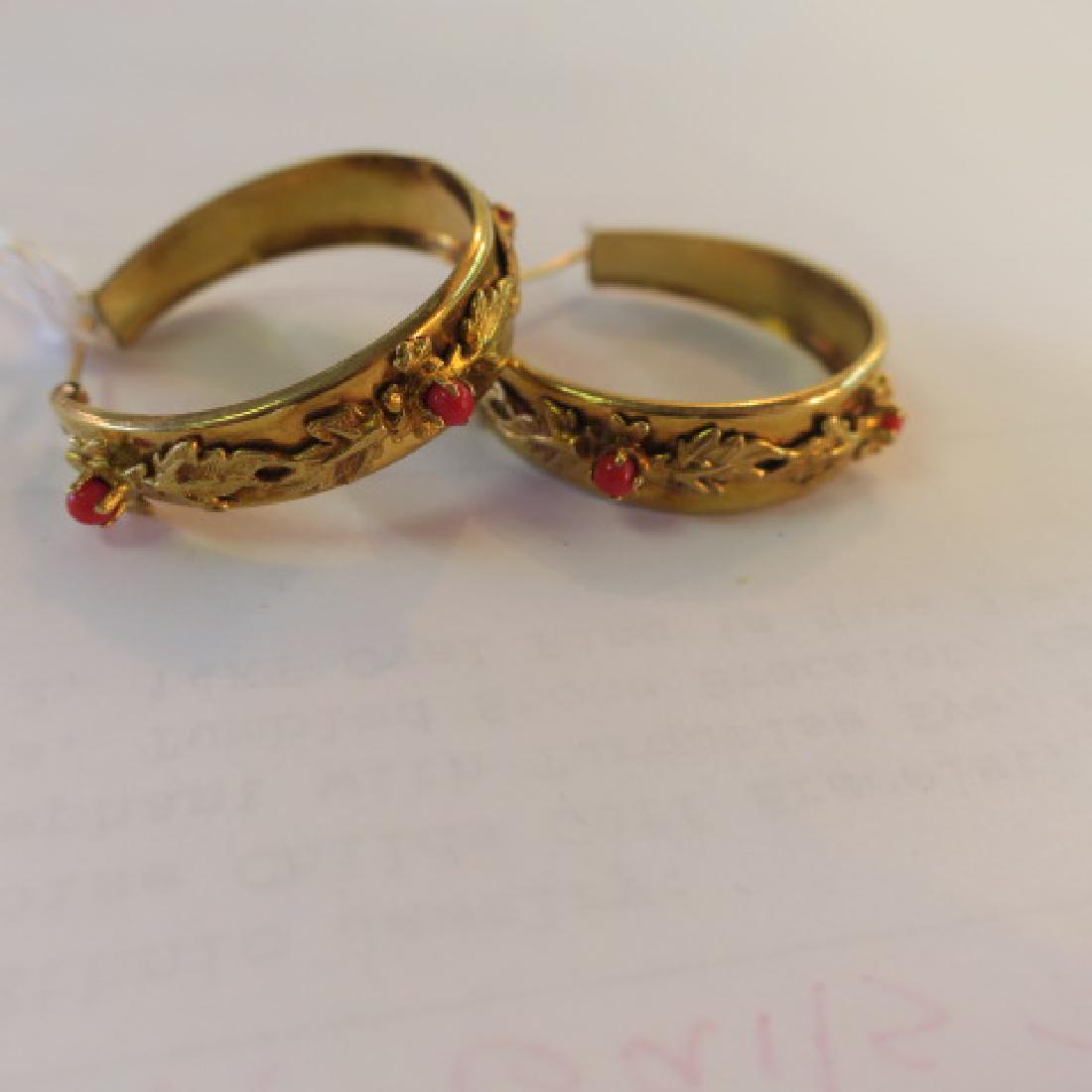 18KT Yellow Gold Hoop Pierced Earrings.: 18KT Yellow Gold Hoop Pierced Earrings. Post/Clasp Snap Closure. Applied Raised Leaves with Three Prong Set Red Coral Beads Set on Tapered Band. (250-400)