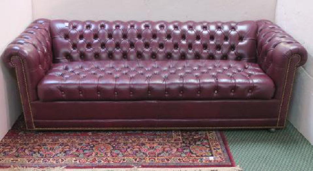 Button Tufted Leather Chesterfield Sofa Bed:: Button Tufted Leather Chesterfield Sofa Bed: Bordeaux Wine Colored with Classic Rolled Arms Accented With Nail head Trip Continuing Across the Apron. Button Tufts Dot the Single seat Cushion, Back and