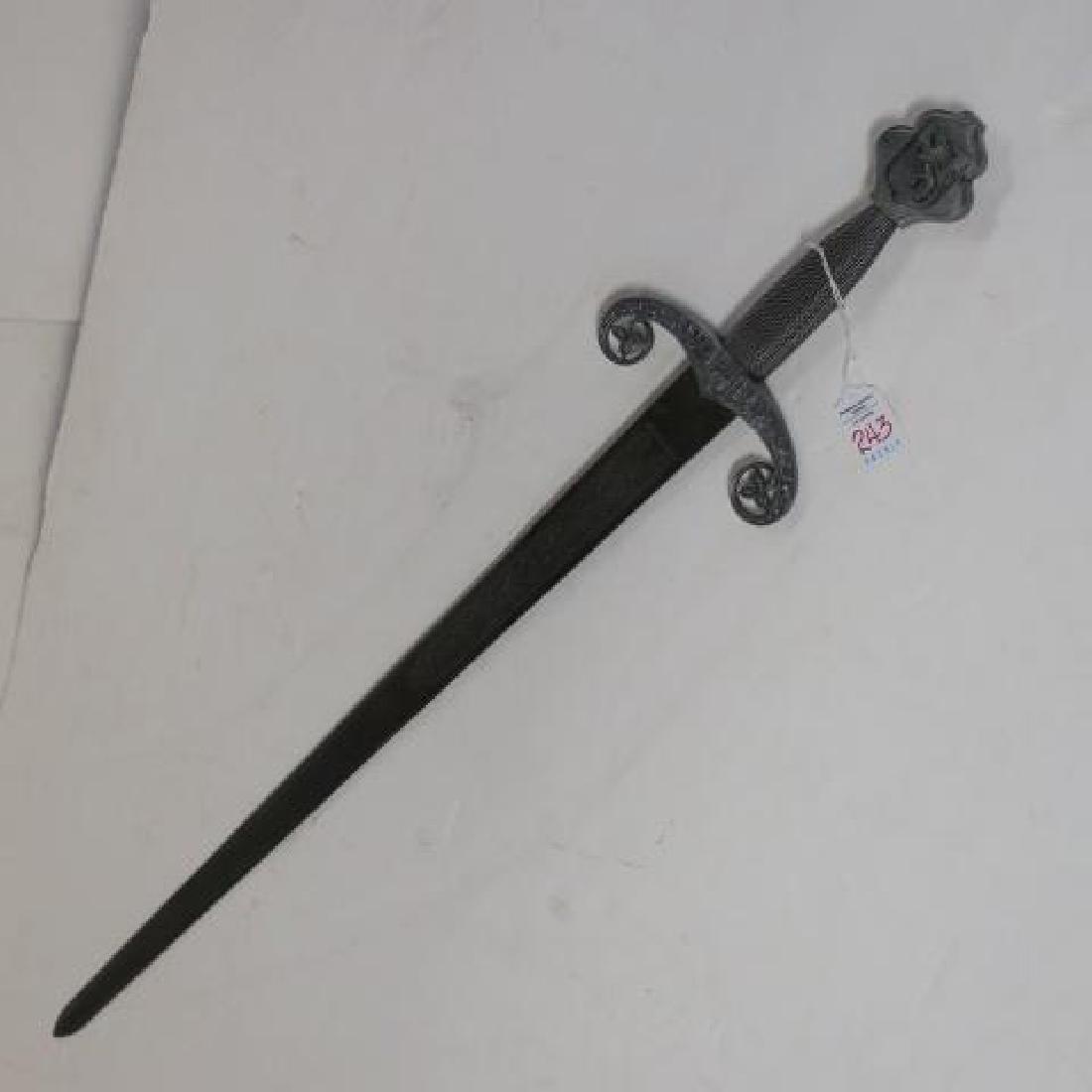 The "Sword of Castilla" made in Toledo Spain:: The "Sword of Castilla" made in Toledo Spain: Castle Decorated Pommel and Hilt. Wire Handle and Curved Celtic Style Hilt. 33" Engraved Blade, 38" LOA. (100-250)