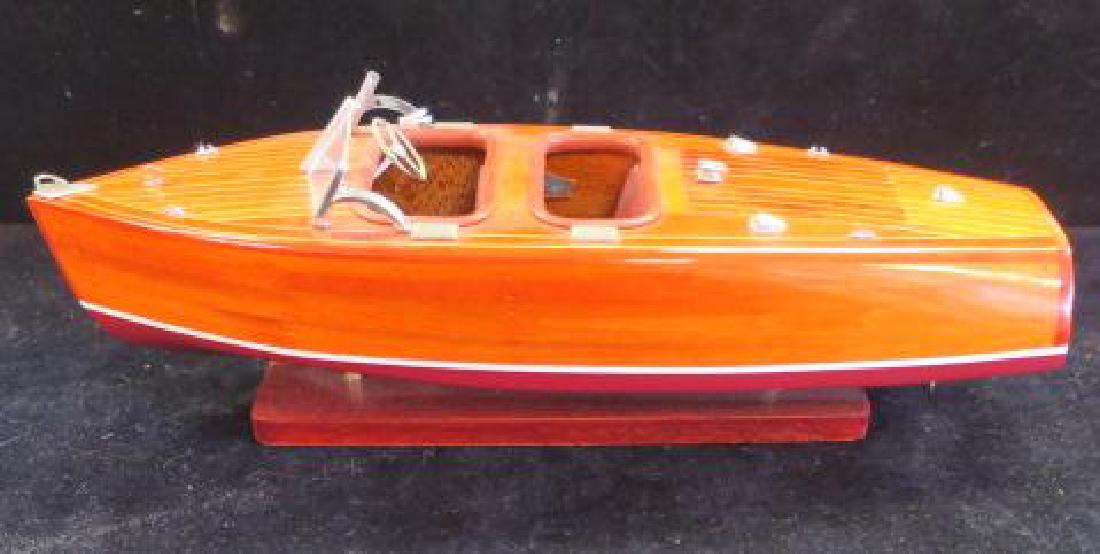 Wooden Model of 1920's Chris-Craft Runabout:: Wooden Model of 1920's Chris-Craft Runabout: 13" Long Wood Model with all the Shine and Polish of the Originals. Metal fittings and Propeller. On Stand. (100-150)