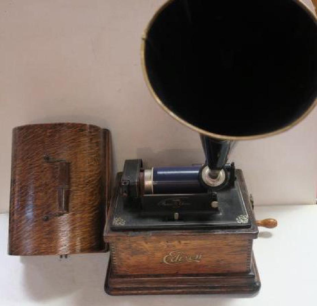 EDISON FIRESIDE PHONOGRAPH Cylinder Player, 15" Horn:: EDISON FIRESIDE PHONOGRAPH Cylinder Player, 15" Horn: Classic Edison Cylinder Player in Small Size. with Top Case. Working, Needs Adjustment. 12" x 11" x 9" with 20 Various Music Cylinders. (300-600)