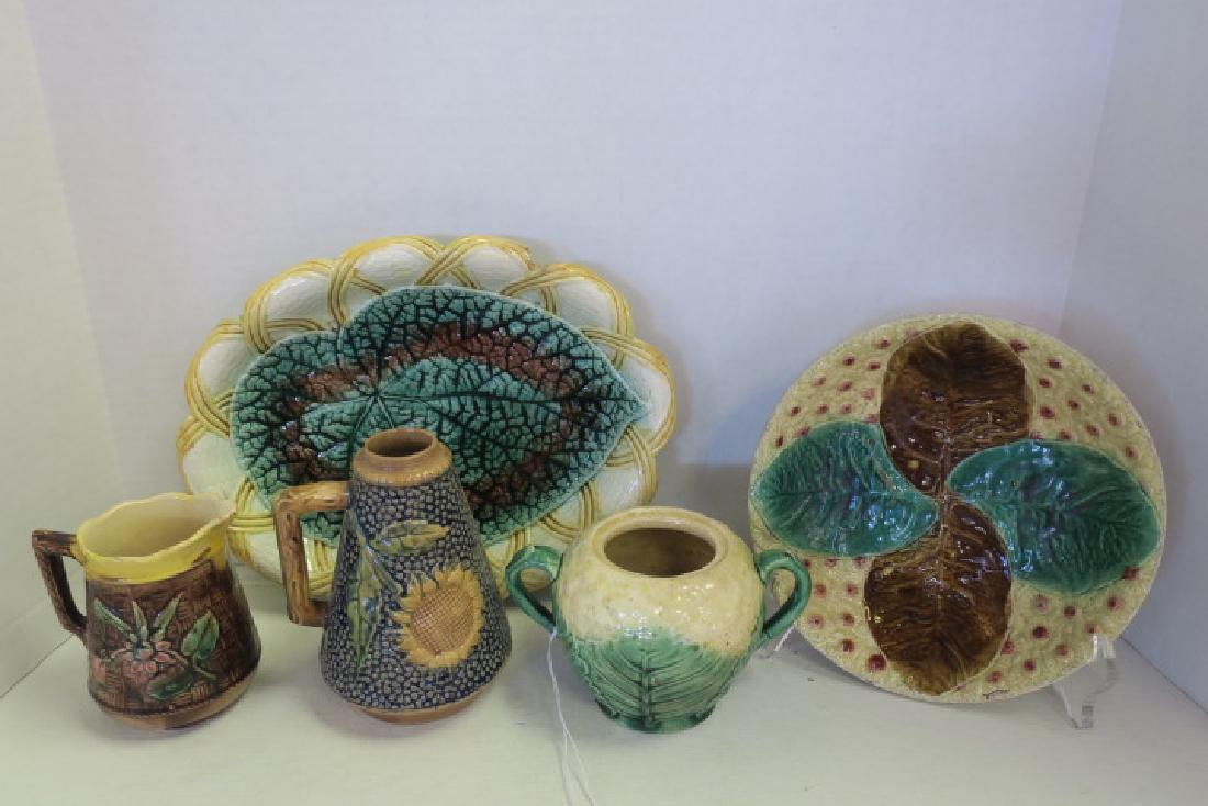 Five Pieces of Majolica Table Ware:: Five Pieces of Majolica Table Ware: Etruscan Majolica Leaf Platter is 12"L. Sunflower Syrup Pitcher (Missing Lid) is 6 1/2"T CA 1890's. 4"T Sugar Bowl (No Lid). Booted Bowl with Small Flowers with Pin