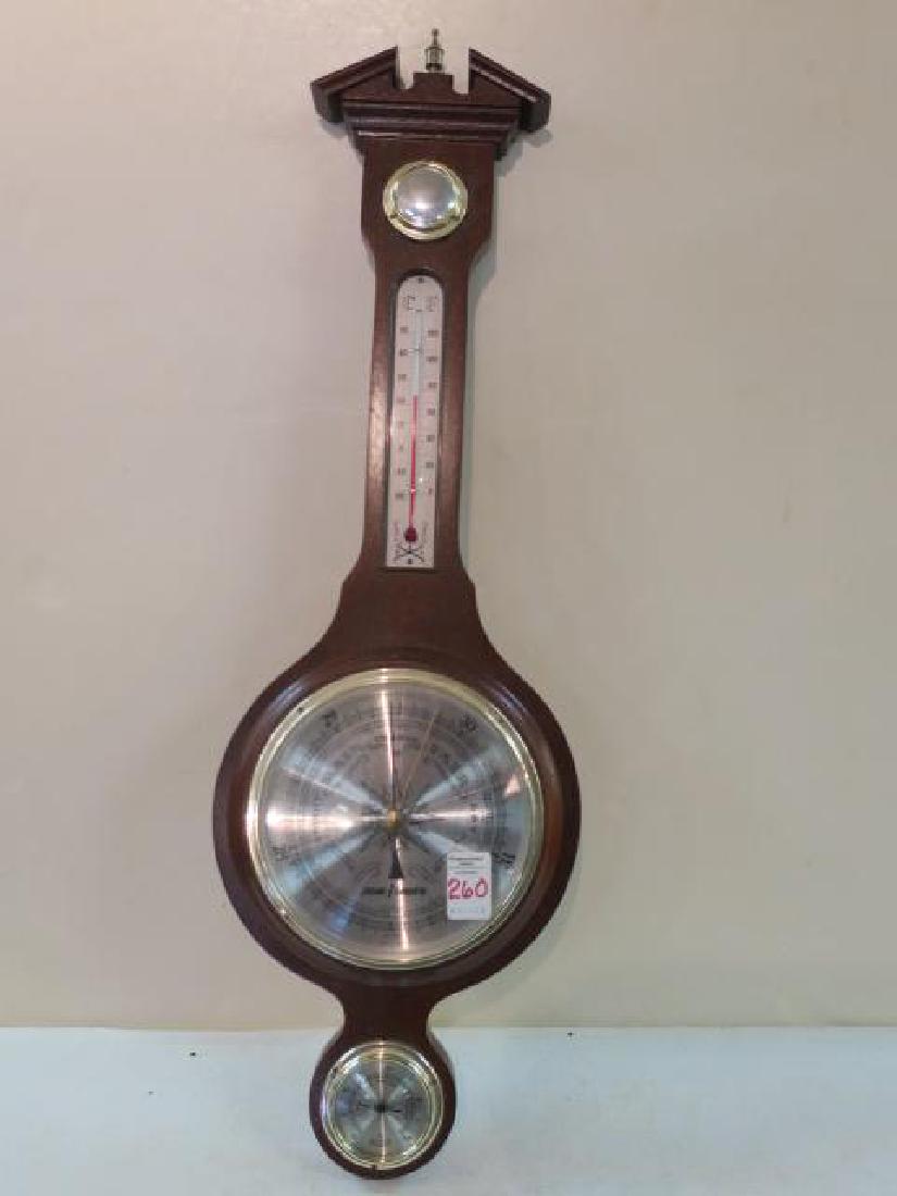 JASON EMPIRE Wooden Weather Station with Brass Finial:: JASON EMPIRE Wooden Weather Station with Brass Finial: Registers Change in Weather Due to Barometric Pressure, Relative Humidly and Tempter. Shaped Wooden Base for Wall Hanging. 28" Tall. (50-100)