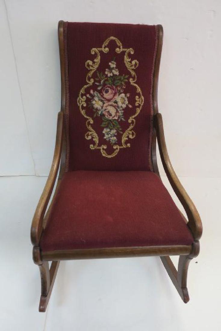 Petite Duncan Phyfe Ladies Needlepoint Rocker:: Petite Duncan Phyfe Ladies Needlepoint Rocker: Elaborate Needlepoint of Roses and Scrolling on Gently Curved Back. Burgundy Ground Continues to Solid Seat. Sloped Curled Arms, Slightly Splayed Legs an