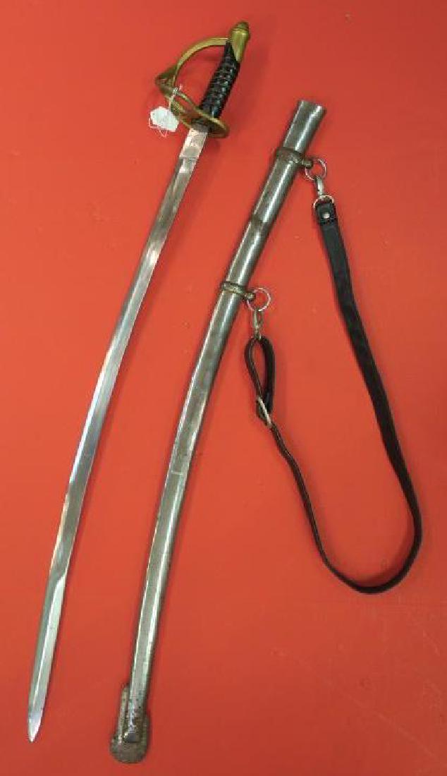 Civil War Replica Cavalry Saber with Scabbard, INDIA:: Civil War Replica Cavalry Saber with Scabbard, INDIA: Used by Many Reenactors, Reproduction of Cavalry Saber with Flourished Curving Brass Guard. Metal Scabbard with Large Drag (Pitted). With Leather