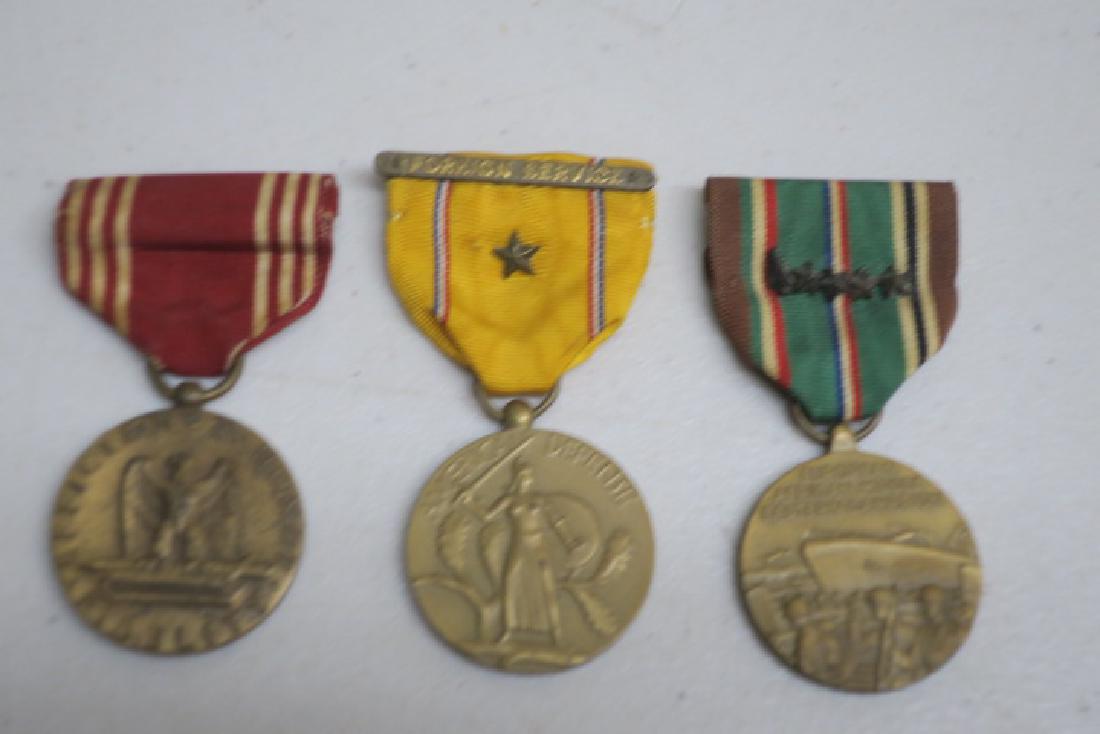 Three World War II American Medals and Awards:: Three World War II American Medals and Awards: Good Conduct Medal, American Defense Medal and European, African, Middle eastern Campaign Medal with Assault Arrow Head and Four Campaign Stars, Likely 2