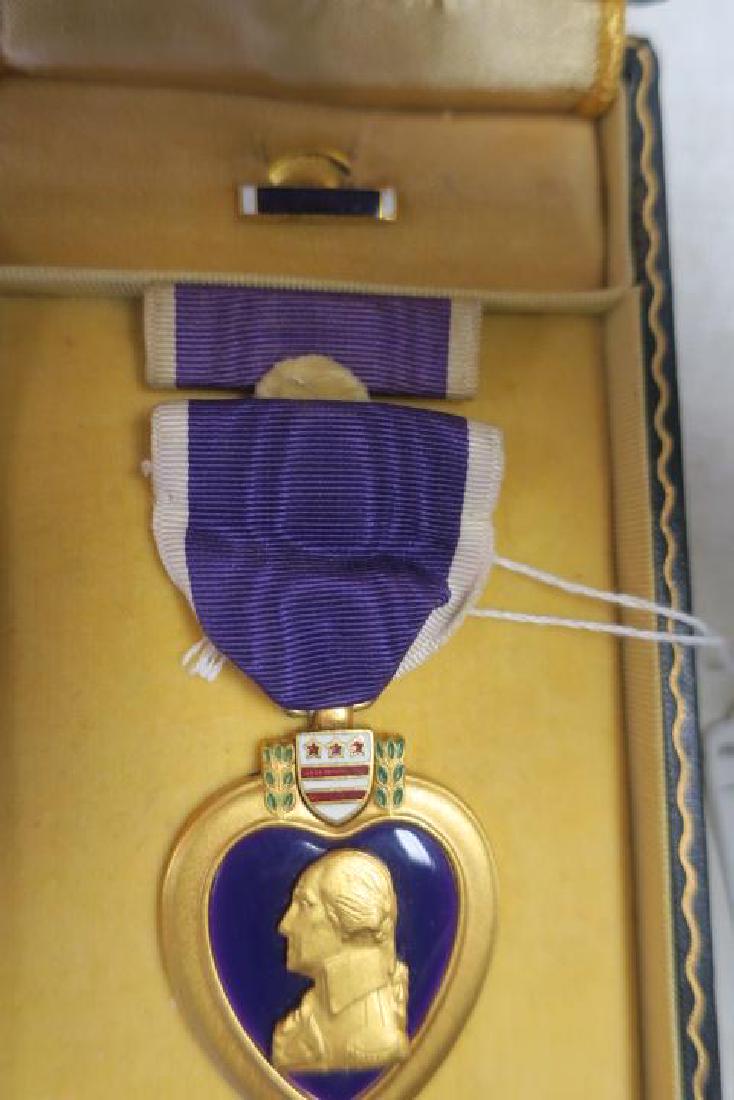 PURPLE HEART MEDAL, JOEL M FAIN, in Presentation Box:: PURPLE HEART MEDAL, JOEL M FAIN, in Presentation Box: Engraved Medal in Box with Service Ribbon and Civilian Small Metal Award for Wear on Civilian Suit. Very good condition. Awarded for being Wounded