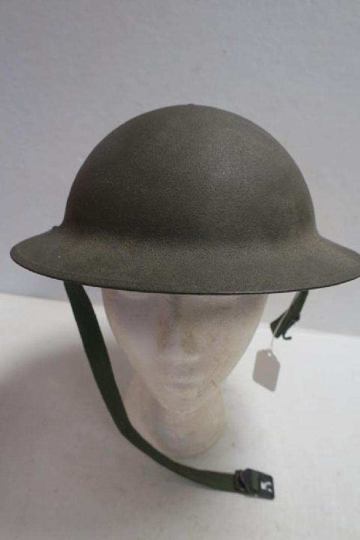 Model 1917 US Army Helmet with Webbing & Chin Strap:: Model 1917 US Army Helmet with Webbing & Chin Strap: Similar to the British Trench Helmet the Army Used this Helmet in the Early days of World war II until the Adoption of the M-1 Helmet. Excellent Co
