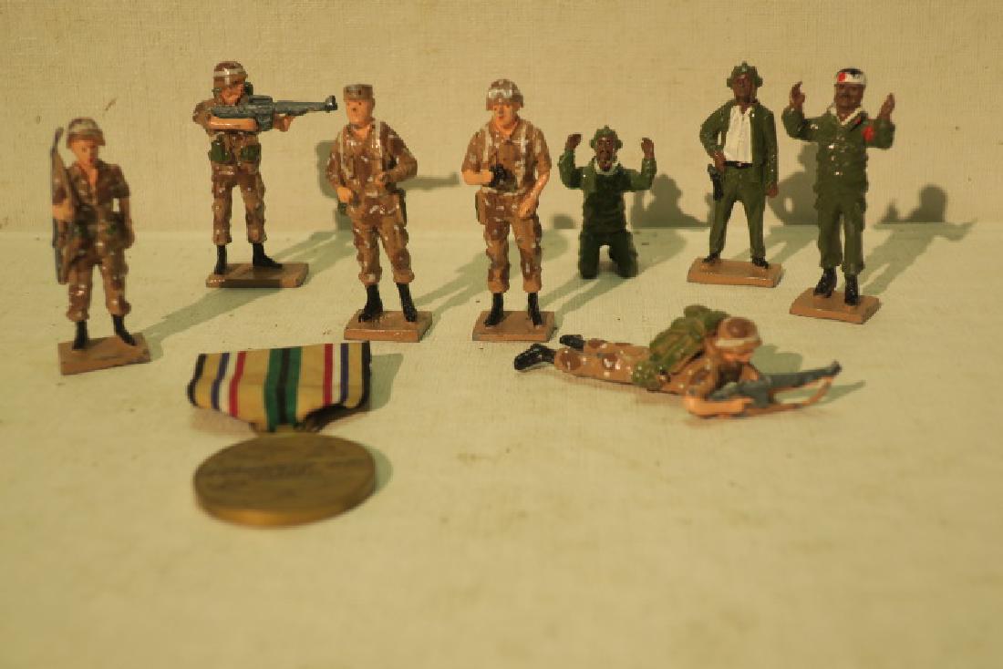 Eight Lead Model Soldiers and SW Asia Service Medal: Eight Lead Model Soldiers and SW Asia Service Medal STORMIN NORMAN and Four Desert storm GI's capture Three Iraqi Tankers. 2 1/4" tall. SOUTHWEST ASIA SERVIVE MEDAL and Ribbon included (100-250)