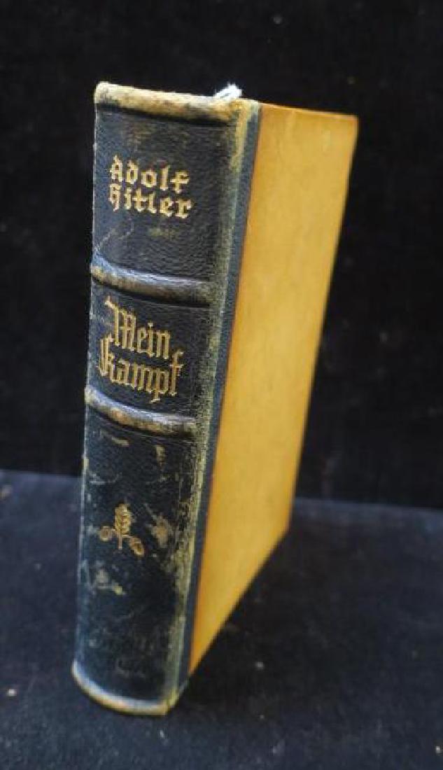Book, MEIN KAMPF, 1941 Edition:: Book, MEIN KAMPF, 1941 Edition: ADOLF HITLER"S MANAFESTO. Published by Berlag Franz Gher Nacht, Munchen, Very Good Condition, Leather spine with Gilt Lettering. This Item will be sold On-line Only. (1