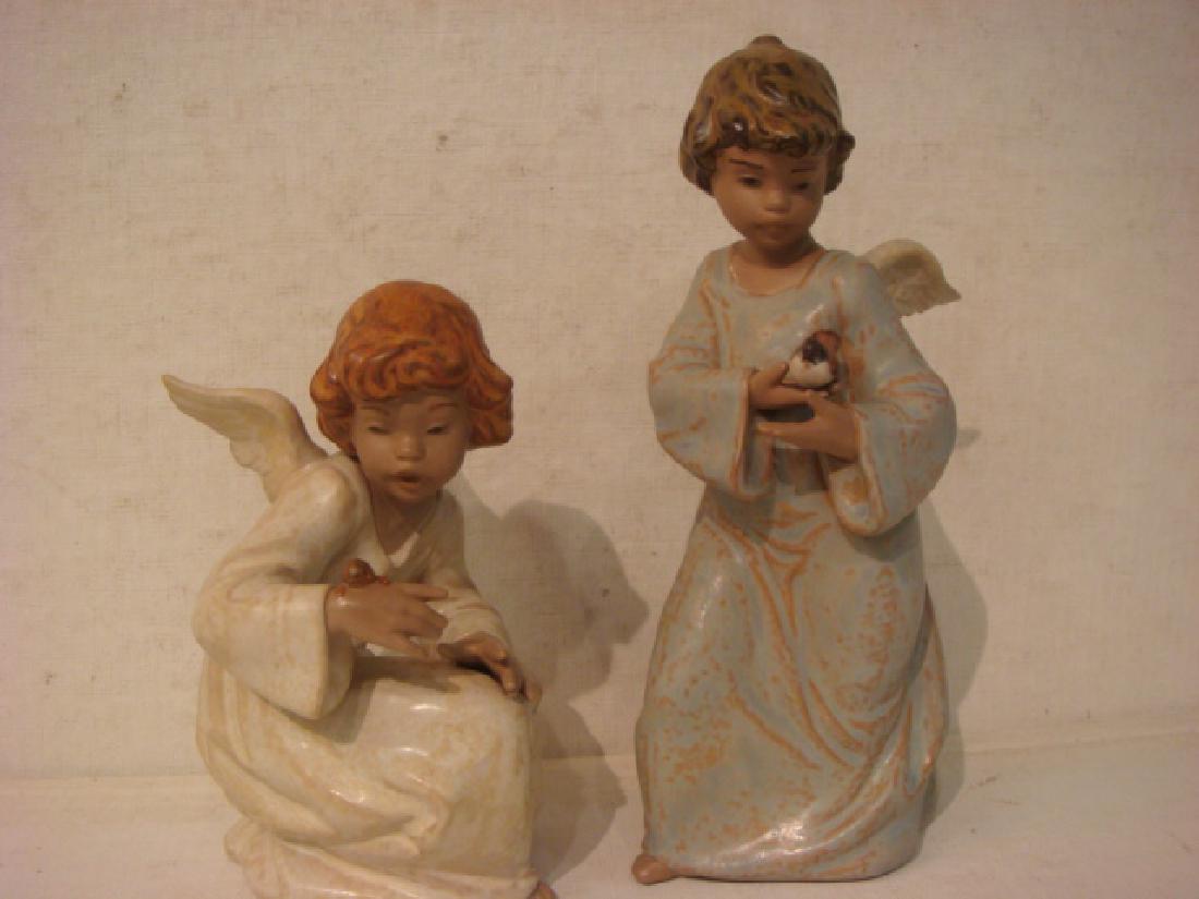 LLADRO Seaside Angel and Friends in Flight Figurines:: LLADRO Seaside Angel and Friends in Flight Figurines: Seaside Angel with Snail (Angelito Con Caraco) Issued 1991, Retired 2015. Friends in Flight (Angelito Con Pajarito) Issued 1991, Retired 2004. 8 3