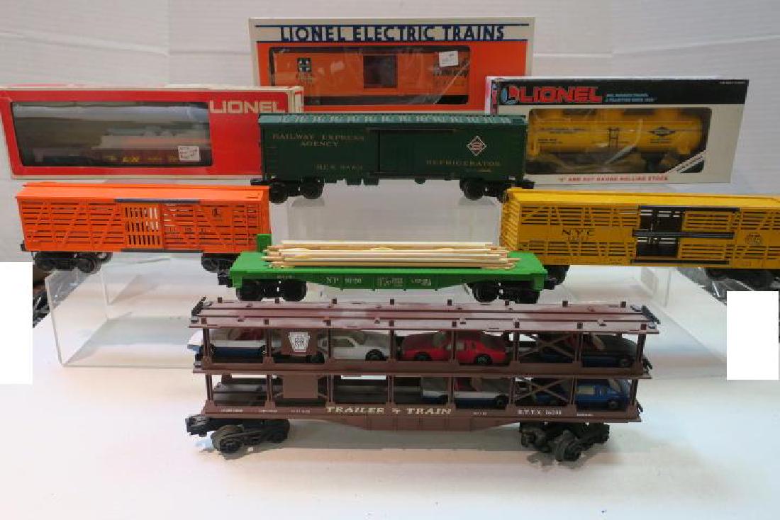 Eight LIONEL Specialty Cars, O Gauge:: Eight LIONEL Specialty Cars, O Gauge: Railway Express Refrigerator Box, PA Car Carrier, DOW CHEMICAL Triple Dome Tanker, Lionel Search Light Car #9302, Lionel Cattle Car #6646, Lionel Flat Car 9120, S