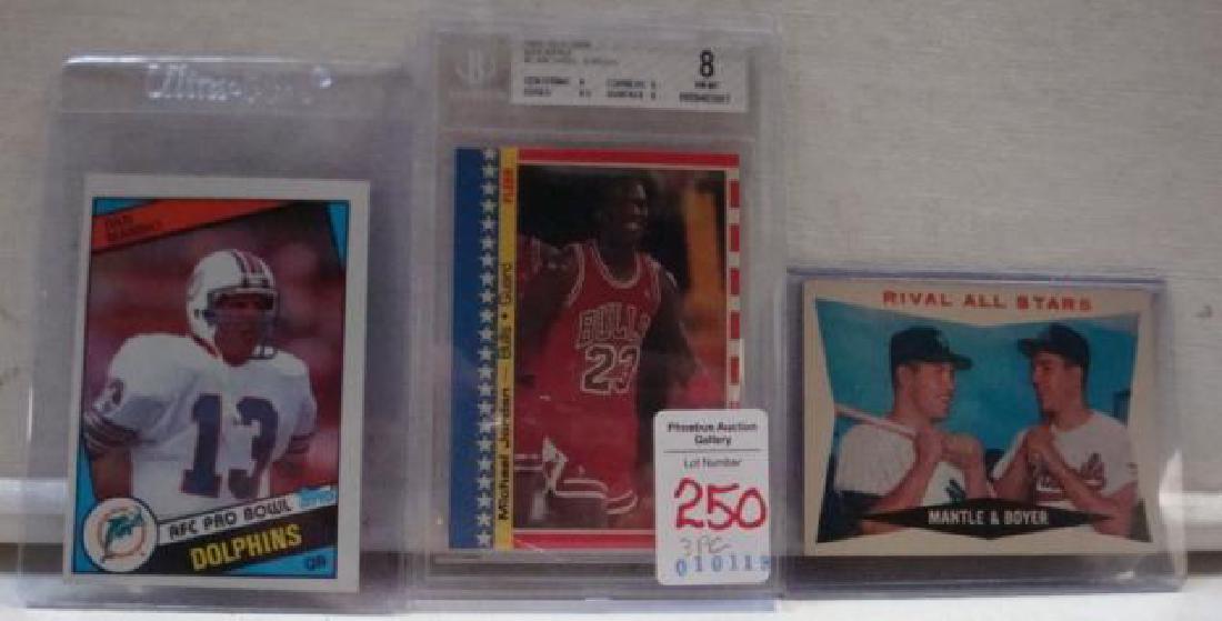 3 Sports Cards; Michael Jordan Mickey Mantle & Marino:: 3 Sports Cards; Michael Jordan Mickey Mantle & Marino: TOPPS RIVAL ALL STARS with Mickey Mantle and Ken Boyer. BECKETT Graded 1987-88 Fleer Michael Jordan #2 Sticker Card in Case. TOPPS AFC PRO BOWL D