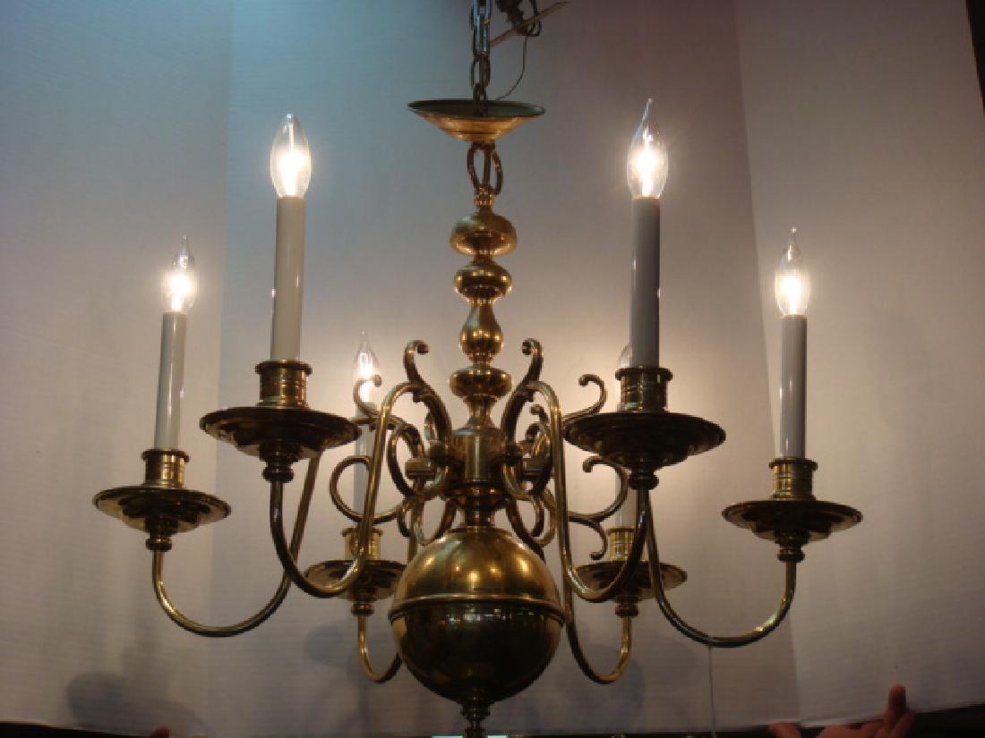 Six Arm Williamsburg Style Brass Chandelier:: Six Arm Williamsburg Style Brass Chandelier: Turned Style Center Column with Six Scrolling Arms. Large Circular Bottom with Ball Finial. 24"T x 26"D. Perfect for over the Dining Table. (200-400)