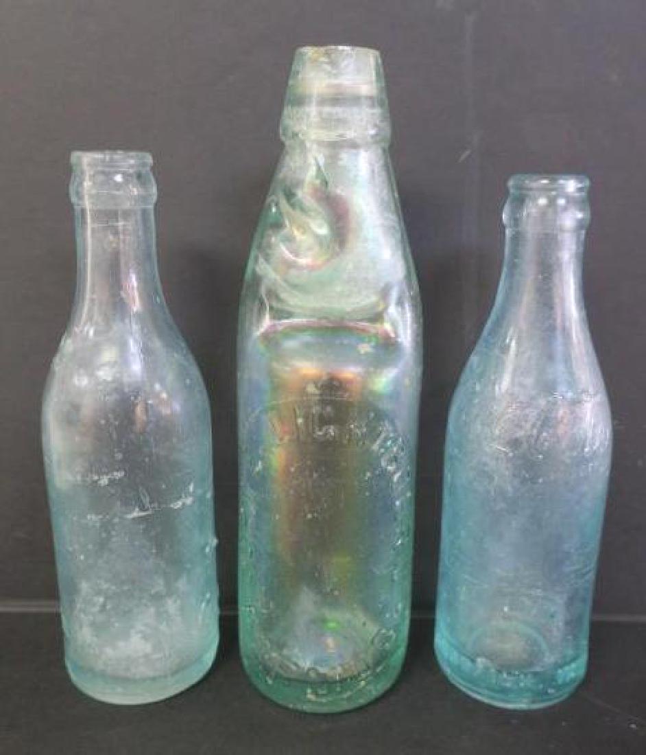 Two Antique COCA COLA Bottles & Bermuda Bottle:: Two Antique COCA COLA Bottles & Bermuda Bottle: 1906-07 Coke Bottle, Straight Sided with Heel Script. G-491 on Bottom. 7 3/4"T. 1913-14 Double Shoulder Script, Straight Sided with Script Coca Cola on