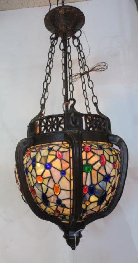 Stained Glass Pendant Light In Metal Frame: Bulbous: Stained Glass Pendant Light In Metal Frame: Bulbous Globe With Hand cut Spider Web Fragments Accented With Oval Cabachon Glass Buttons. Satin Finish Bronzed Mounting With Saratoga Finial, Curved Spoke