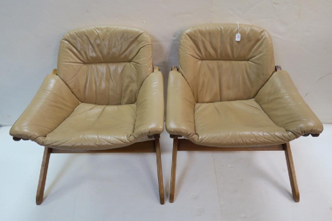 Pair of GOTE MOBEL Sweden Leather Mid Century Chairs:: Pair of GOTE MOBEL Sweden Leather Mid Century Chairs: These Modernist Artisan Womb Style Lounge Chairs Derive Their Comfort from Their Shape. Camel Colored Leather Upholstery with Padded Seat, Slightl