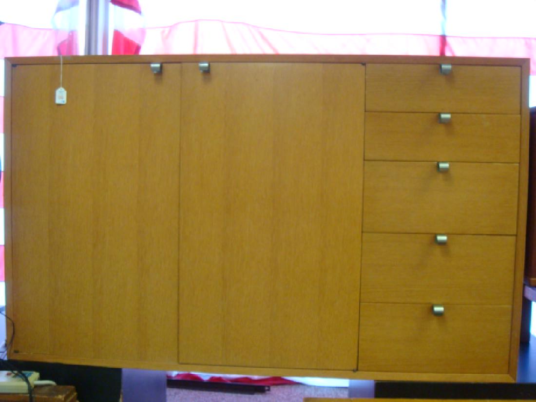 GEORGE NELSON for HERMAN MILLER Server:: GEORGE NELSON for HERMAN MILLER Server: Blonde Teak Server with Five Stacked Drawers beside Double Blind Cabinet with Two Silver Drawers and Shelved Compartments. 34" x 56" x 18 1/2". (2000-5000)
