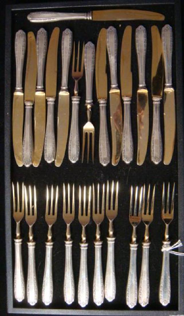German 800 Silver and Gilt Fruit Knives and Forks:: German 800 Silver and Gilt Fruit Knives and Forks: Service for 12, Matches #136. Knives are 6 1/2" and Forks are 5 5.8". Gilt Blades and Tines. (200-400)