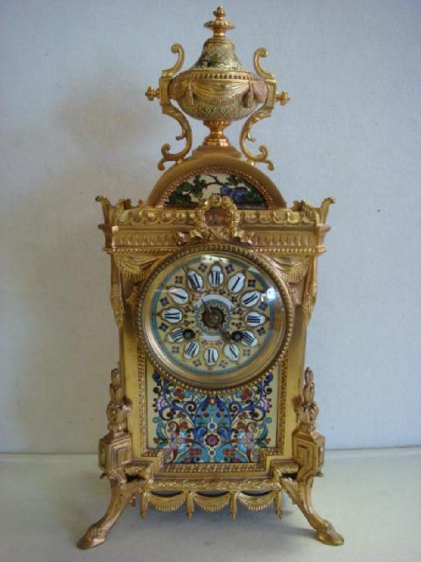 French JAPY FRERES Cloisonne Clock:: French JAPY FRERES Cloisonne Clock: #1315 4.8 Shelf Clock with Gilt Brass or Bronze Case with Hoof Feet, Crown Top with Urn Finial, Curtain Swags and Wreath. Cloisonne Panels on Front, Sides and Face 