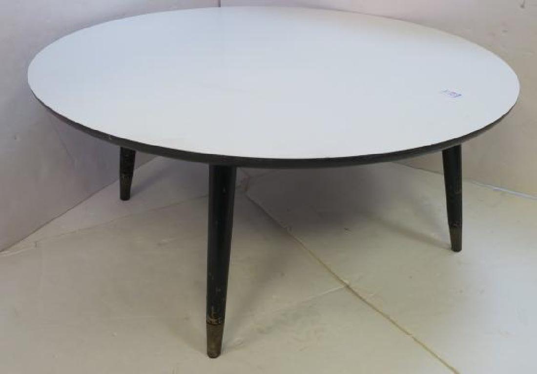 Mid-Century Modern Round Formica Top Cocktail Table:: Mid-Century Modern Round Formica Top Cocktail Table: Single Tier Table with White top and Splayed Tapered Legs with Metal Cap Feet. 16" Tall, 35" Diameter, Minor Nicks on Edge, (100-200)