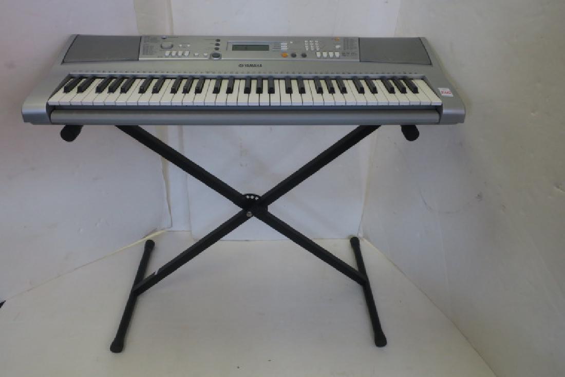 YAHAMA YPT 300 Portable Grand Piano with Stand:: YAHAMA YPT 300 Portable Grand Piano with Stand: 61 Key Electric Keyboard 5" x 37" x 14" Stand 31" Tall. (150-300)