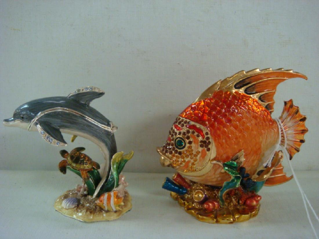 Two Enameled and Jeweled Sea life Trinket Boxes:: Two Enameled and Jeweled Sea life Trinket Boxes: Jay Strong water Style. Tropical Fish Amid Corals, Plants and Shells has Crystals on Face and Eyes. Unmarked. 3 3/4"T, 4"W. Dolphin with Turtle and Fis