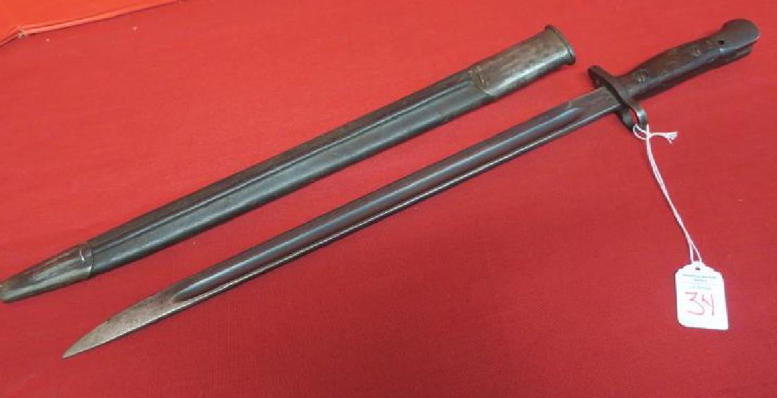AUSTRALIAN LITHGOW 1907 BAYONET for SMLE ENFIELD:: AUSTRALIAN LITHGOW 1907 BAYONET for SMLE ENFIELD: Eagle Head Pommel, Spring Attachment, Wooden Grips, Quillion and 17" Straight Blade with Fuller. Leather Scabbard with Throat, Frog & Tip. DTG. 5/24. 
