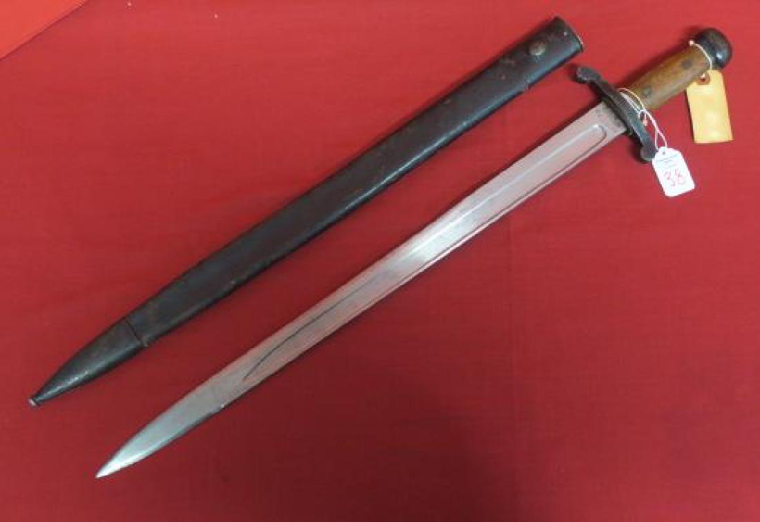 RARE JAPANESE MEIJI 26 (1893) ARTILLERY SWORD:: RARE JAPANESE MEIJI 26 (1893) ARTILLERY SWORD: Russo-Japanese War Era Artillery Sword made by the Tokyo Arsenal. Iron Pommel, Wooden Handle, Iron Cross Hilt. 21" Single Edge Tapered Blade with Fuller 
