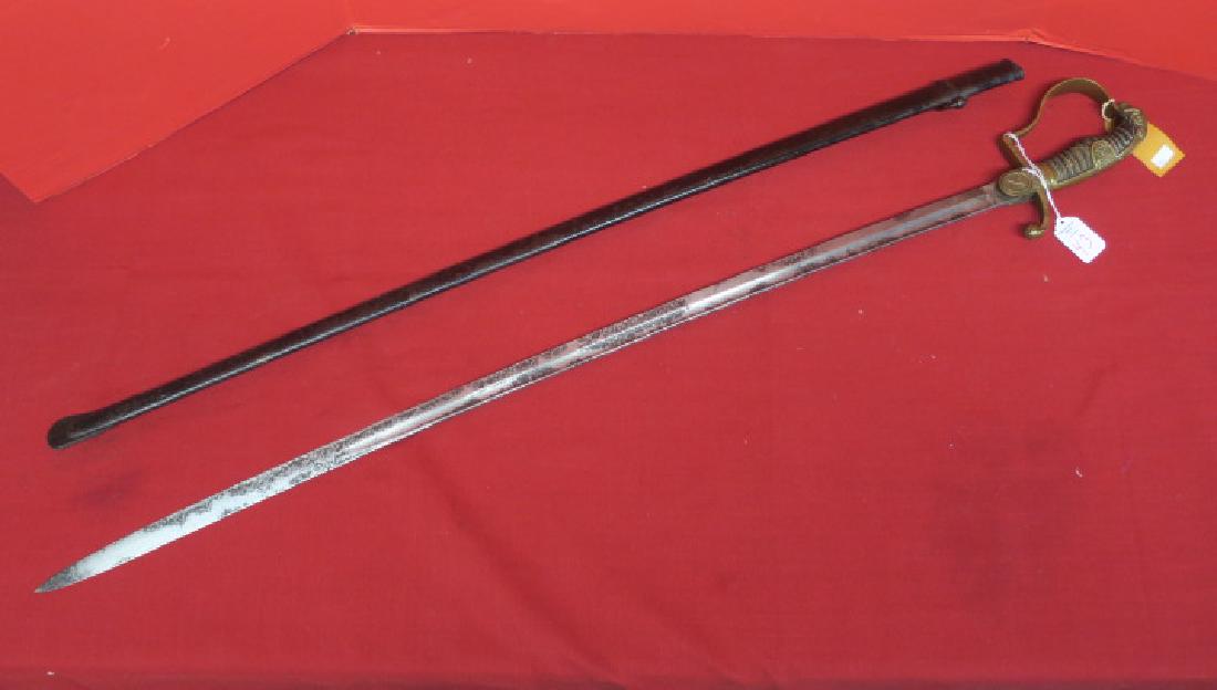 GERMAN World War I Era Cavalry Saber, 38"LOA;: GERMAN World War I Era Cavalry Saber, 38"LOA; Lionhead Pommel with Backstrap, wooden Grip with Leather covering and Gilt Twisted Wire. P Shaped Knuckle-bow and Looping Quillion. Langat with Crossed Sa