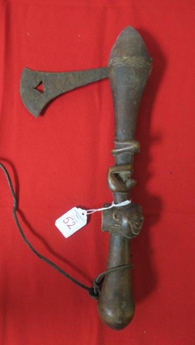 African Birds Eye Fighting Axe with Decorated Shaft:: African Birds Eye Fighting Axe with Decorated Shaft: Birds Eye in Axe Head Guides Stroke. Naked Kneeing African Princess Decorates the Handle. Axe Edge 3" by 6", Handle 15 1/2" CA 1850. (100-500)